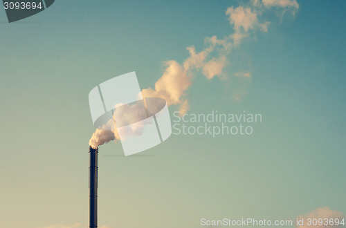 Image of Factory with smoking chimney