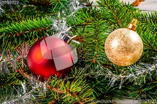 Image of Christmas baubles on pine