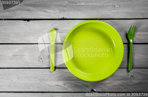 Image of Plate on wood background