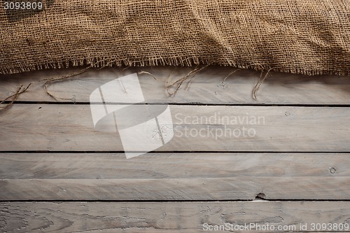 Image of Wood background with hessian textile