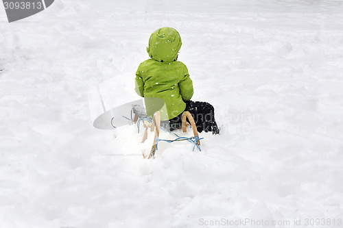 Image of A child on sled