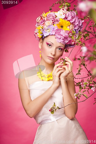 Image of Beautiful girl with flowers in her hair. Spring.