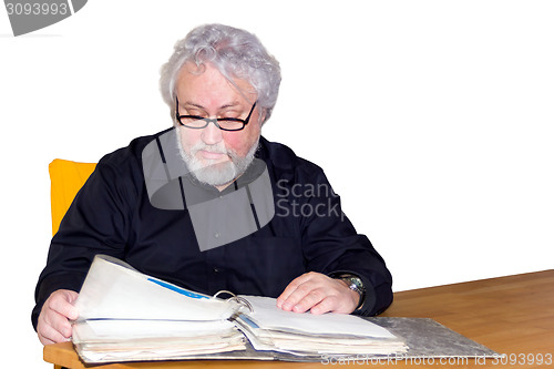 Image of Senior is checking some papers