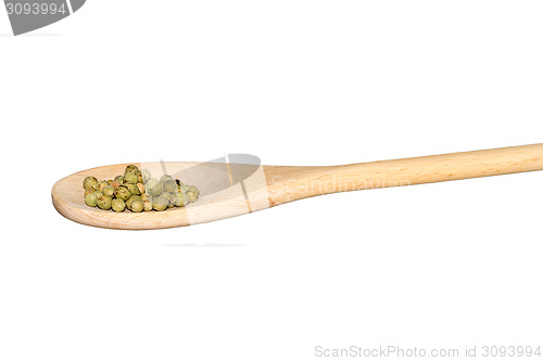 Image of Green pepper on a light wooden spoon