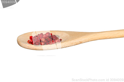 Image of Red pepper on a light wooden spoon