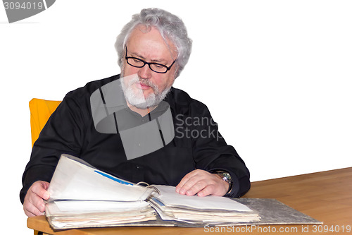 Image of Senior is checking some papers