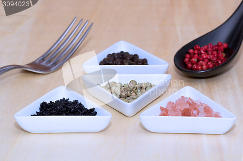 Image of Variety of peppercorns and salt