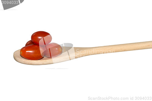Image of Grape tomatoes on a light wooden spoon