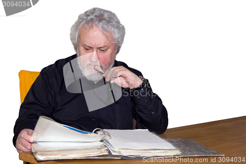 Image of Senior is checking some papers