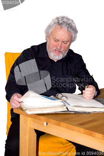 Image of Senior is checking some papers