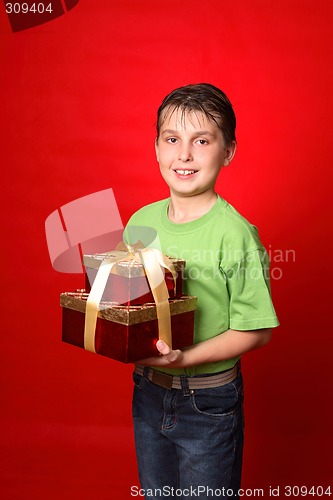 Image of Boy carrying gifts