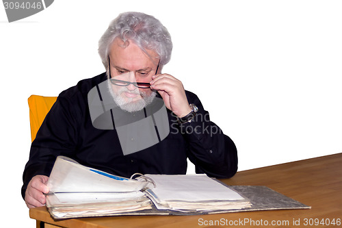 Image of Senior is checking some papers