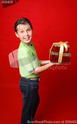Image of Smiling child carrying gifts