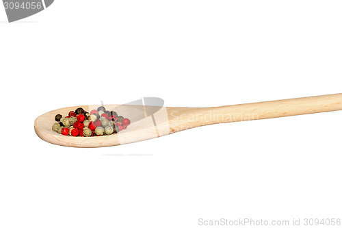 Image of Mixed pepper on a light wooden spoon