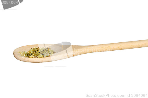Image of Fennel seeds on a light wooden spoon