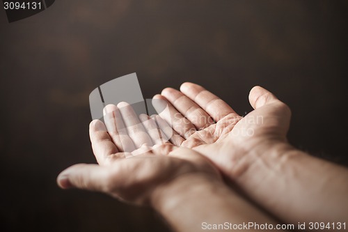 Image of hands begging 