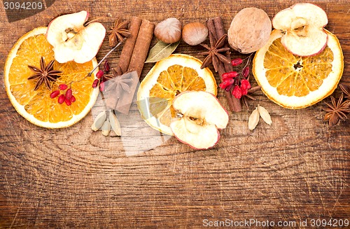 Image of Christmas spices and dried orange sliceson 