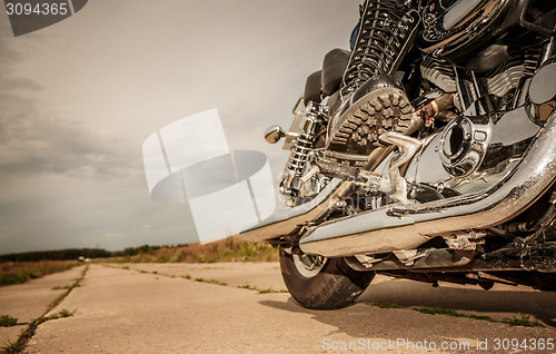 Image of Biker girl riding on a motorcycle