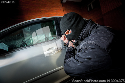 Image of Car thief in a mask.