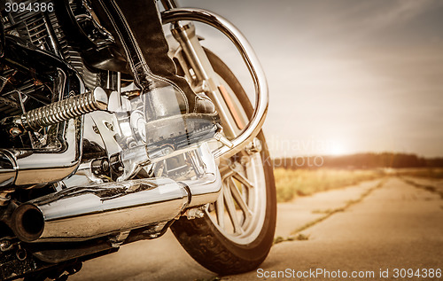 Image of Biker girl riding on a motorcycle