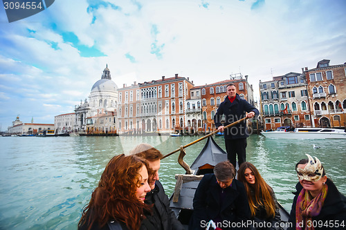 Image of Gondola with tourists in Venice