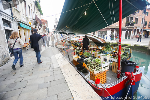 Image of Boat with fruit and vegetable in water canal