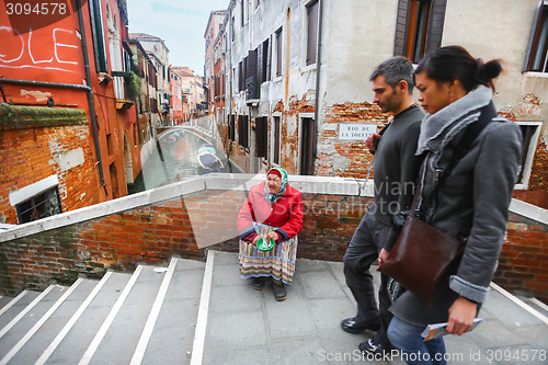 Image of Woman begging for money in Venice