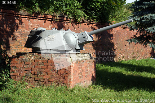 Image of Old gun near the wall