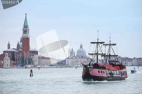 Image of Galleass sailing in italian water canal