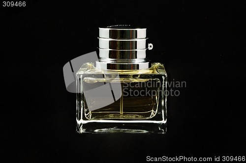 Image of Bottle of perfume over black background