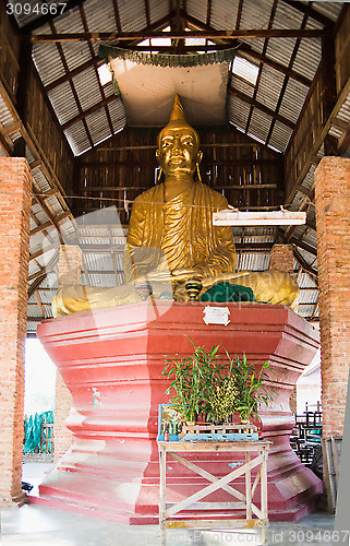 Image of Buddha image in simple pavilion