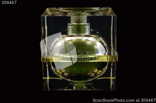 Image of Bottle of perfume over black background