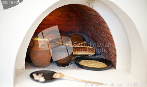 Image of big stove with food inside