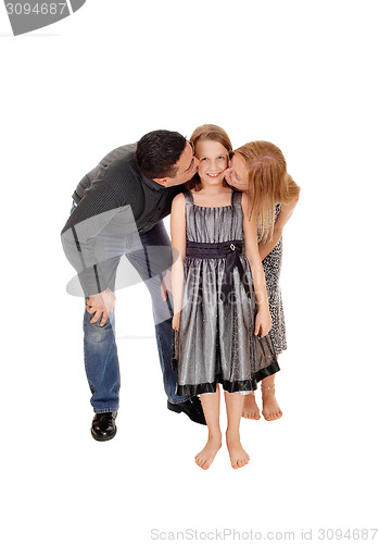 Image of Parents kissing there daughter.