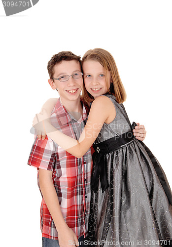 Image of Brother and sister hugging.