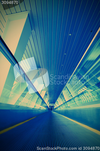 Image of blue moving escalator