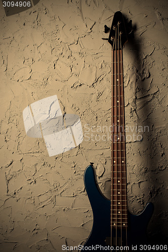 Image of guitar near wall