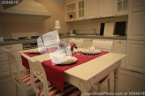 Image of served table in interior of the trendy cuisine