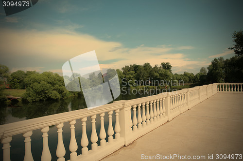 Image of country landscape with white balustrade