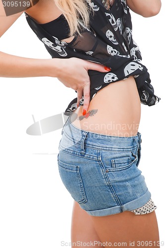 Image of Woman hip with tattoo