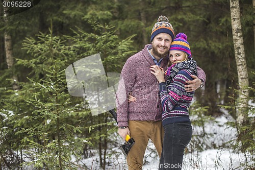 Image of Young pair searching a christmas tree
