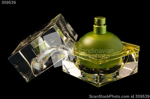 Image of Opened perfume bottle over black