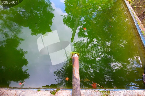 Image of green piping fresh water reservoir