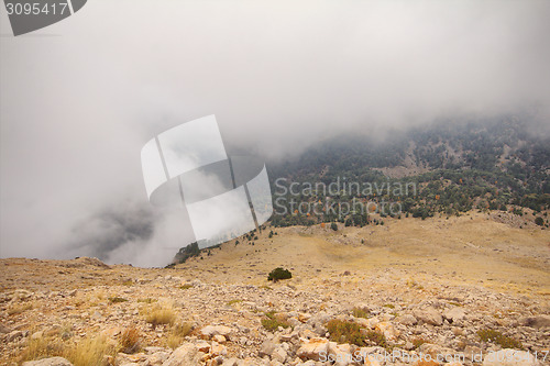 Image of mountains peaks clouds ran over  tops