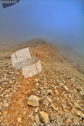 Image of very beautiful mountain trail in fog