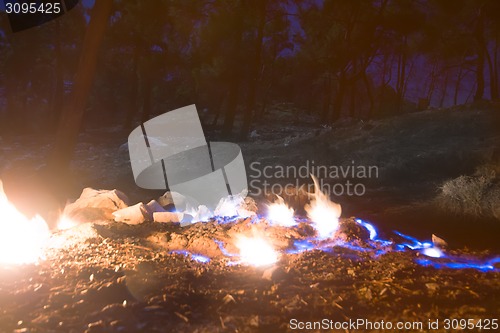 Image of natural gas burns a flame at night