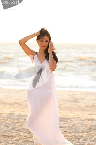 Image of Beautiful girl on the sea shore