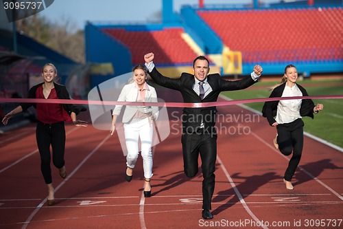 Image of business people running on racing track