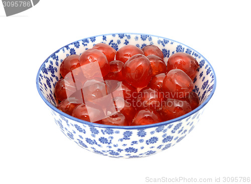 Image of Glace cherries in a blue and white china bowl