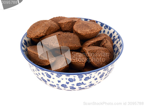 Image of Brazil nuts in a blue and white china bowl
